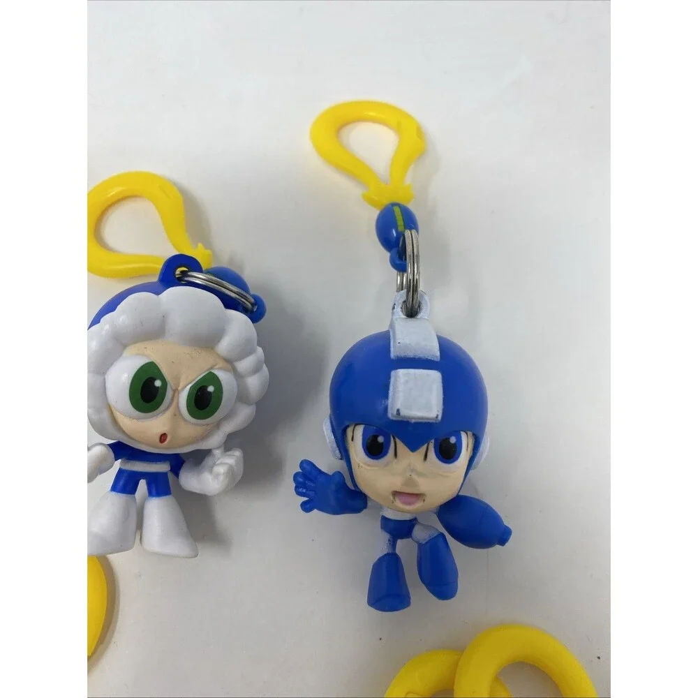 lot of 9 CAPCOM MEGA MAN BACKPACK HANGERS METALLIC FIRE MAN JUST TOYS INTL.